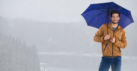 Man with umbrella over bright icy lake