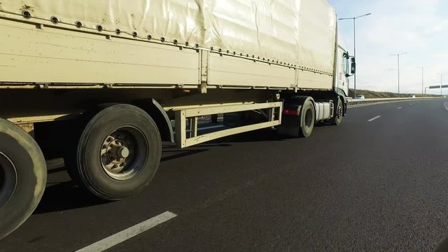 Semi truck overtaking fast on highway, POV