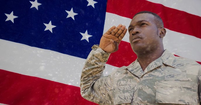 veterans day soldier in front of flag - Powered by Adobe