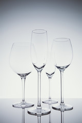 Glassware selection with wine, champagne and liquour glasses  on the light background