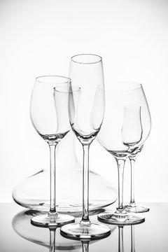 Glassware selection with wine, champagne, liquour glasses and decanter on the light background
