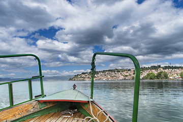 Tourist fishing boat ride pov with view of beautiful Ohrid old town in Macedonia