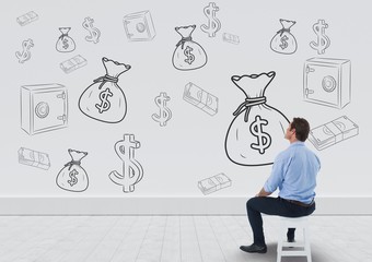 businessman sitting in front of money on wall