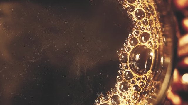 Macro shot of cup with hot coffee on roasted coffee beans in 4K(UHD)