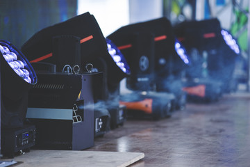 The smoke generator emits smoke on stage during the concert. the generator stands on the stage and works.