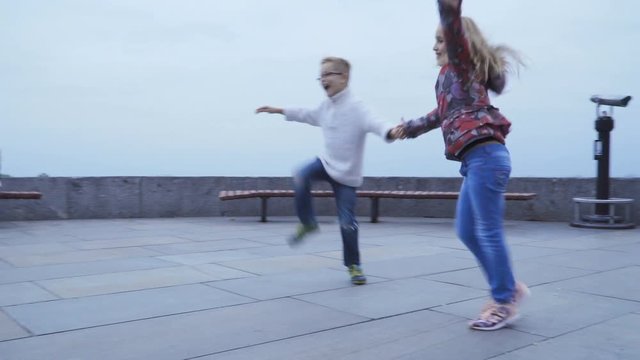 Kids dancing fast dance outdoors