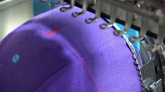 Closeup of Industrial Embroidery Machine Embroidering Hat