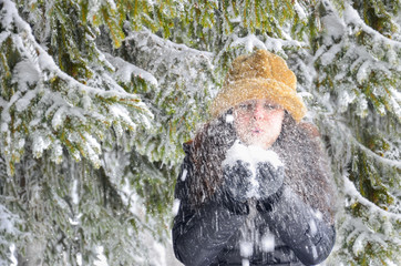Girl and snow blowing