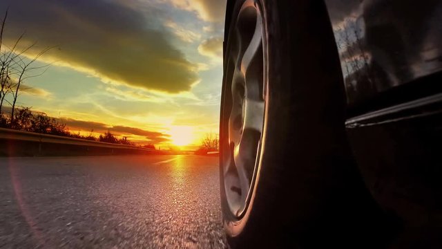 Timelapse of Driving towards the sunset. pov with lens flare