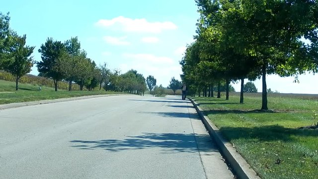 A Journey: Man Walking on Boulevard with Shirt Unbuttoned (Frontside)