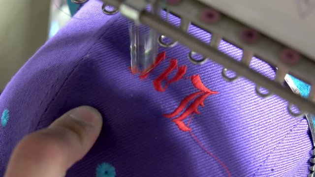 Closeup of Industrial Embroidery Machine Embroidering Hat