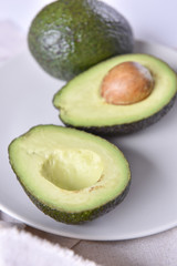 Ripe avocado on a plate.