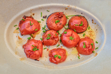 Tomatoes are cooked on a grill