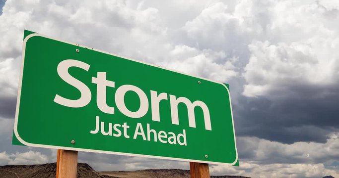 4K Time-lapse Storm Green Road Sign and Stormy Cumulus Clouds and Rain.