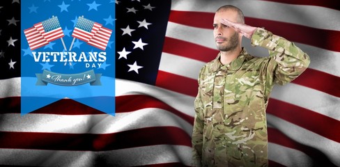 Composite image of soldier giving salute