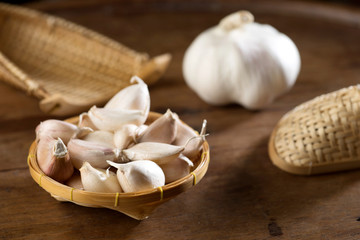 close up shot of garlic on wood background