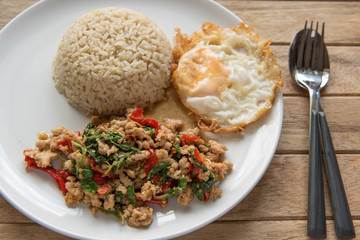 Stir fried chopped pork with chili and basil, served with steamed rice and fried egg,Pad Kra-prao,Thai style food