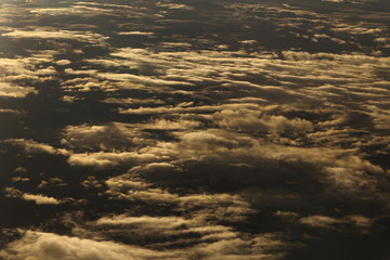 Sunset White Cloud sky at high level attitude, view from window airplane