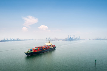 container ship sails out of the harbor