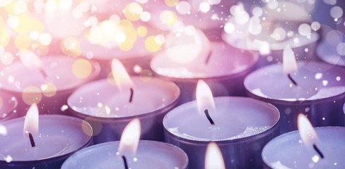 Obraz na płótnie Canvas Illuminated candles during Christmas time