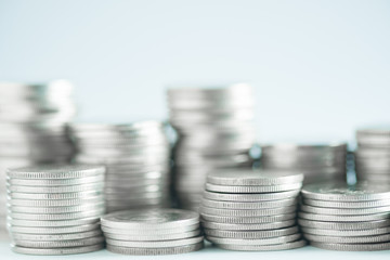 Piles of coins on working table, finance and business concept, shallow focus.