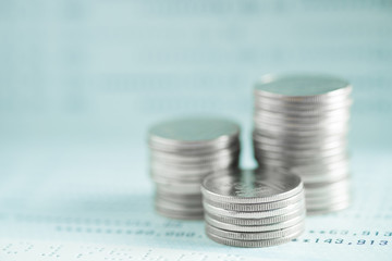 Stacks of coins and account book or credit card on working table, finance, business finance...
