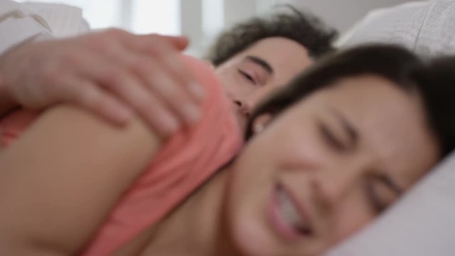  Man trying to instigate affections with his partner in bed but has no success