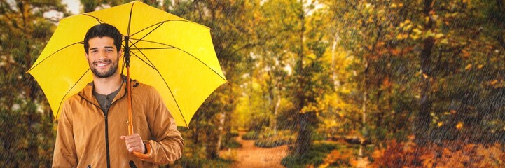 Composite image of portrait of smiling man holding yellow