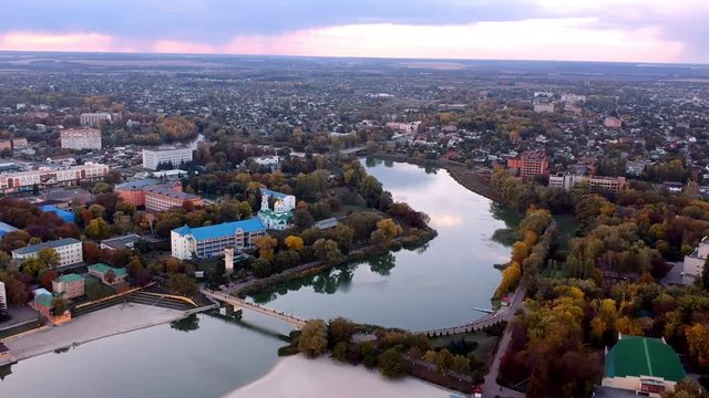 Aerial view on Mirgorod city, Ukraine. Old video style, low light evening sunset autumn footage
