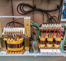 Electric transformer main in control panel box, in factory industry
