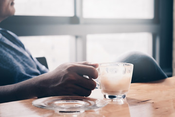 businessman hand holding coffee cup During the meeting in office
