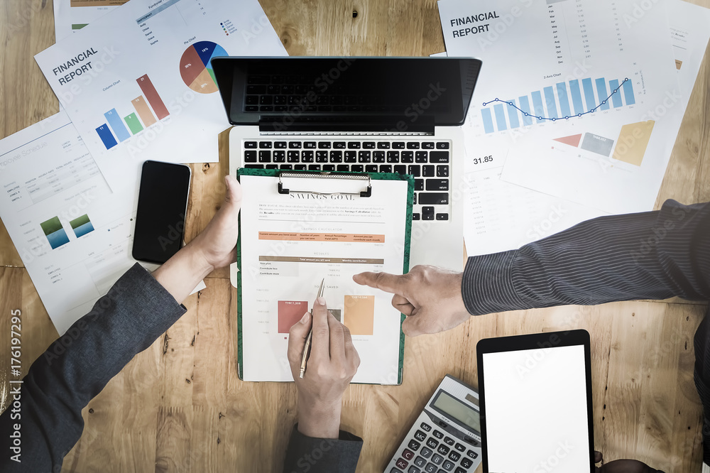 Poster businessman pointing graph chart with pathner for analyze plans