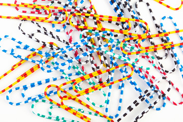 Obraz premium colored paper clips on a white background