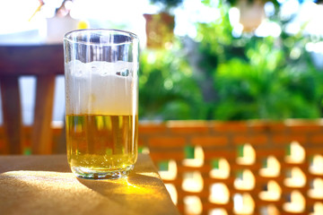 A glass of beer on a table