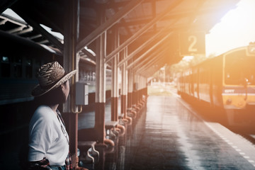 Summer travel,hipster travel are Waiting for the train at the pl