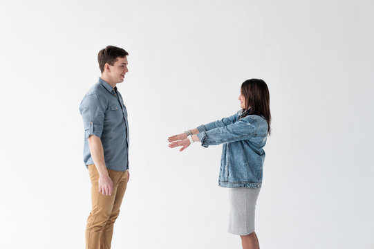 Young Couple, Man And Woman In Trendy Jeans Clothes, Studio Shot On White Background