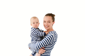 Mom is holding a son in vests