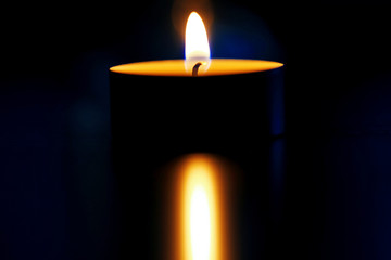 Candle in the dark room