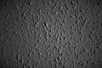 Closeup of dark grunge textured wall with  vignetting, may use as background with copy space for text.