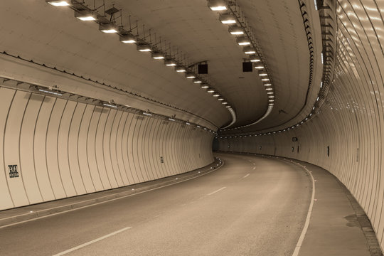 Fototapeta Bend in a road tunnel without traffic