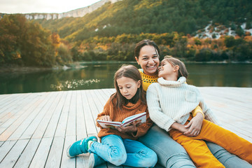 Family spending time together by the lake