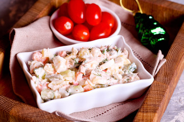 A bowl of potato salad with creamy mustard dressing.