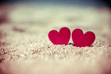 romantic symbol of two hearts on the beach 