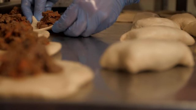 Baker working with bread dough