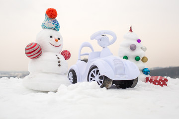 Snow sculpture with smiley face on winter day