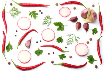 mix red hot chili peppers with parsley and sliced radish and garlic isolated on white background top view