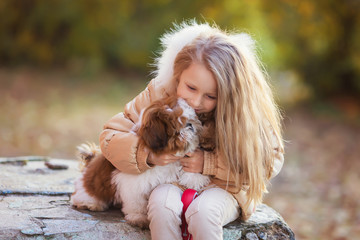 Sweet girl with puppy love hugs