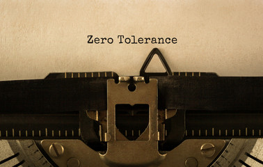 Text Zero Tolerance typed on retro typewriter