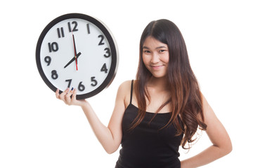 Young Asian woman with a clock.
