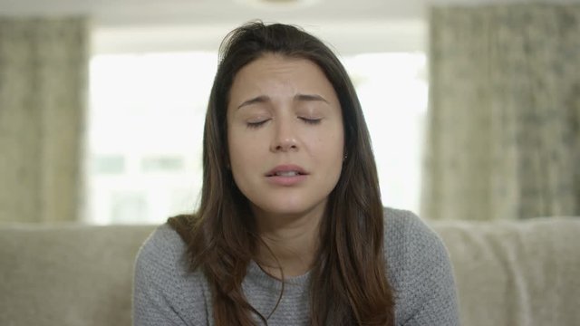  Sad woman making emotional video call on computer, as seen from screen's pov.